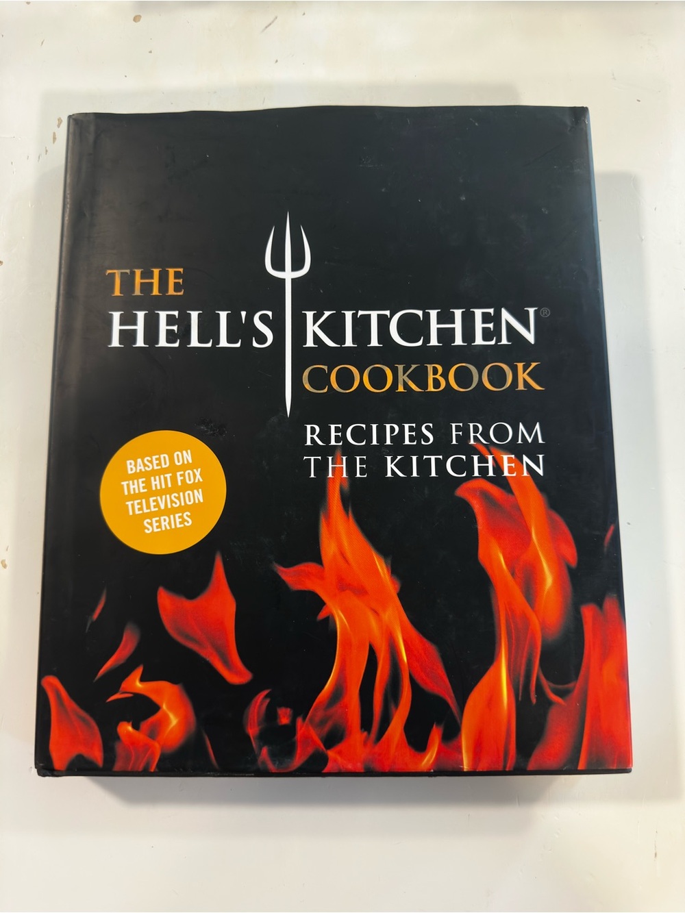 The Hell's Kitchen Cookbook - Black with Red/Orange Flame Design